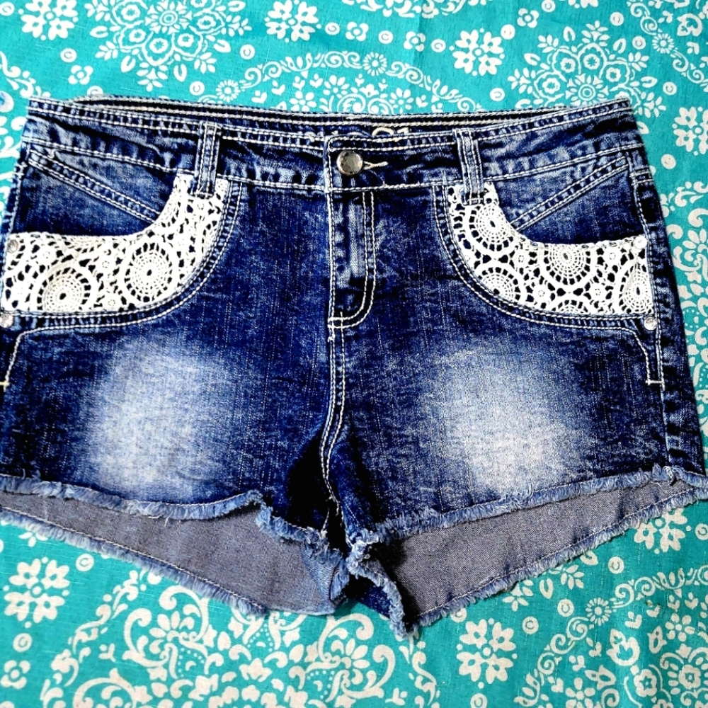 Stylish Blue Jean shorts with lace covered pockets